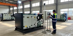 Technician monitoring PowerLink diesel and gas generators in an industrial power solutions setting
